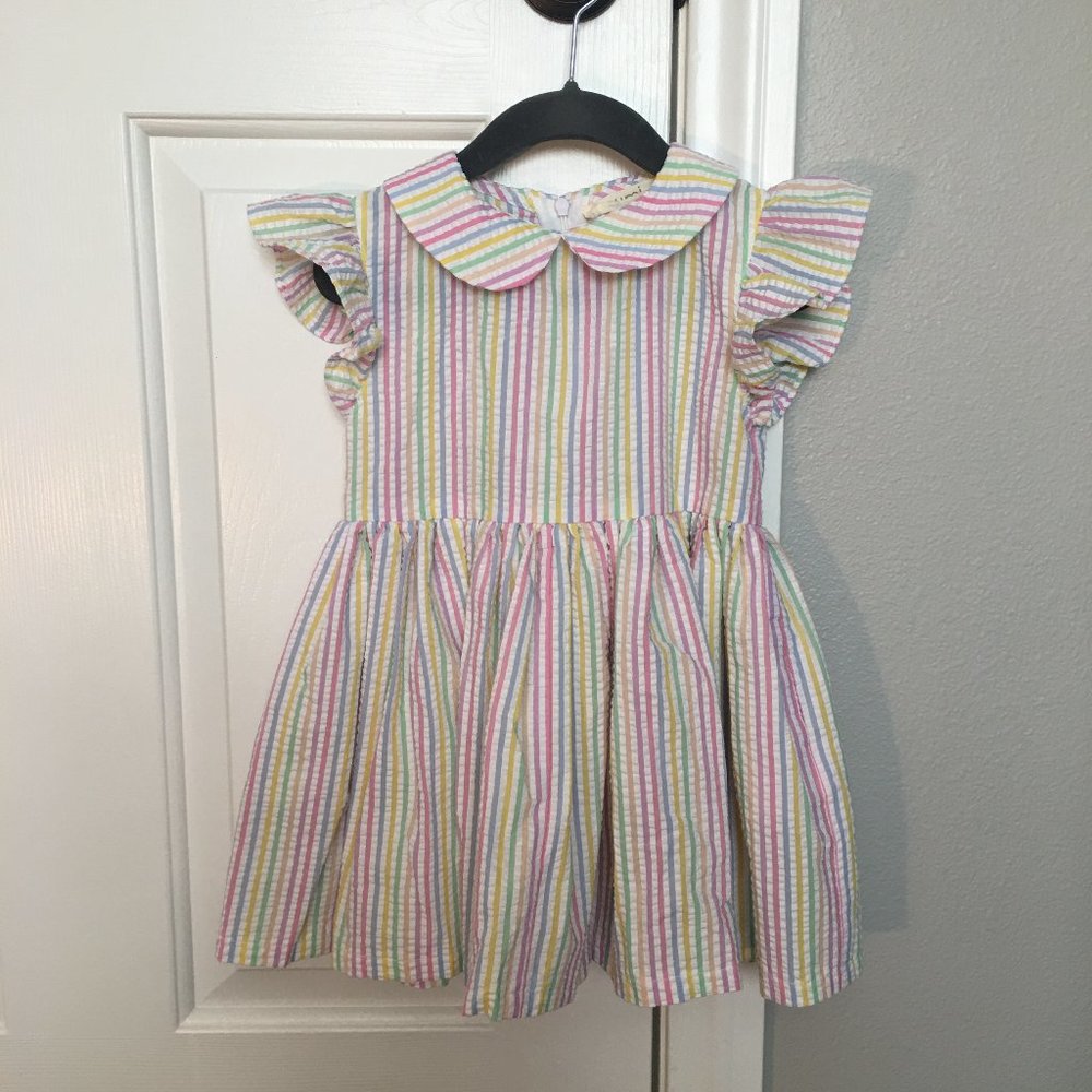 Numi white seersucker dress with pastel rainbow of stripes, detachable bloomers